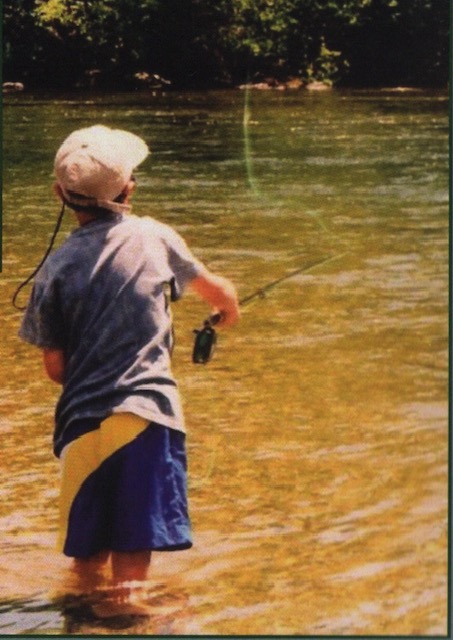 Angler on a small remote brook trout stream