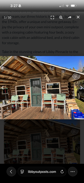 Historic log cabin exterior with rocking chairs on the porch