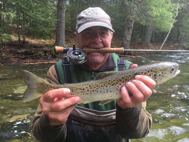 Angler with a landlocked salmon